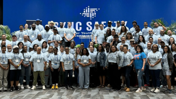 A group photo of a diverse and intergenerational group - SYNC