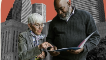 Older woman points to a document while standing with a man holding a folder; city buildings rise in the background with a red sky