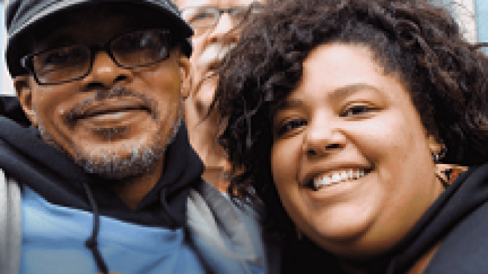 two people smiling at the camera